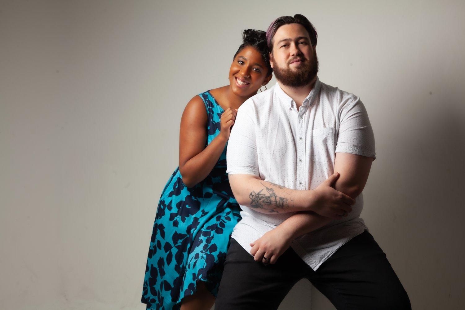 Rhyana and partner Matt sat smiling at the camera.