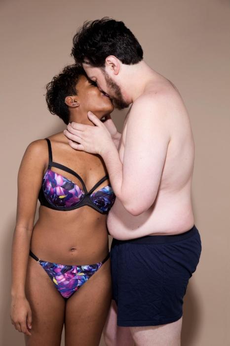 Rhyana in purple floral bikini with Matt in blue underwear as they share a kiss.