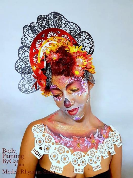 Rhyana dressed in black, white and red skull motif with matching make up.