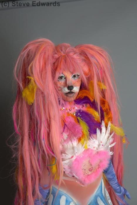 Mid shot of Rhyana in a colourful fox outfit with a long pink wig.